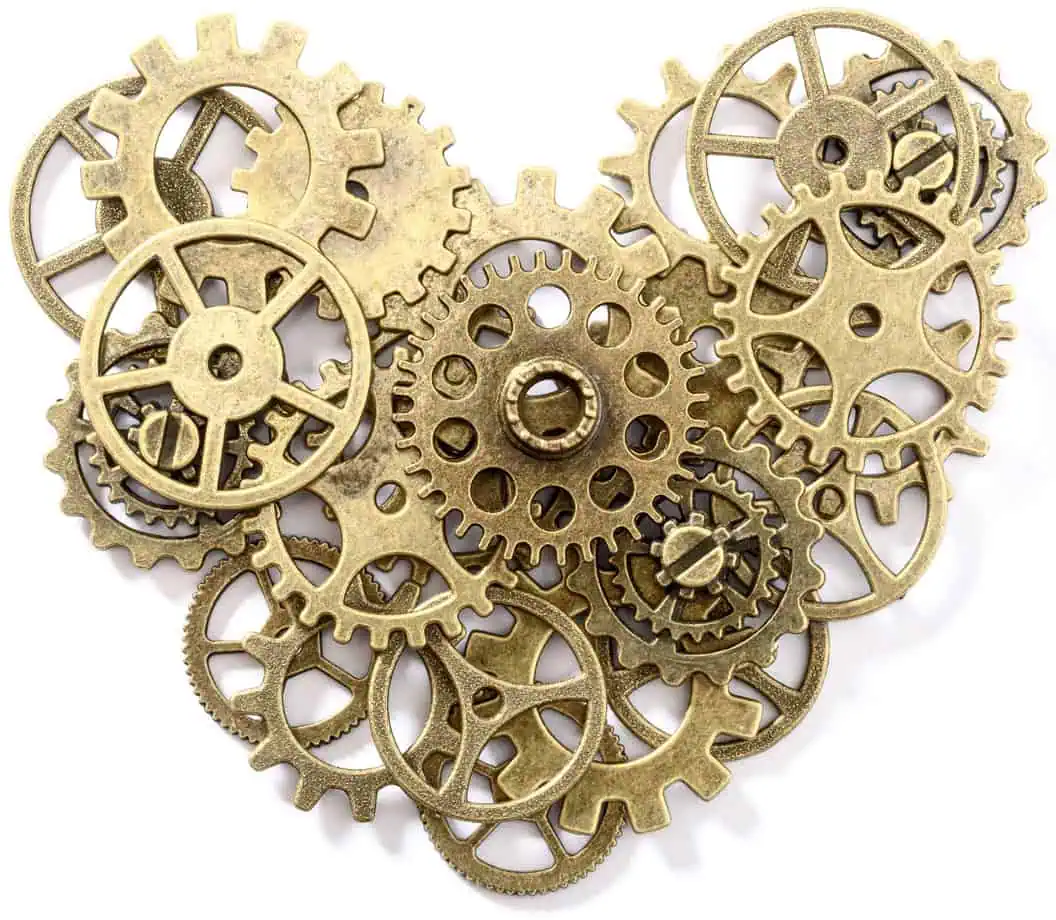 Eine Ansammlung von Zahnrädern aus Metall in unterschiedlichen Größen und Designs, die übereinander angeordnet sind.